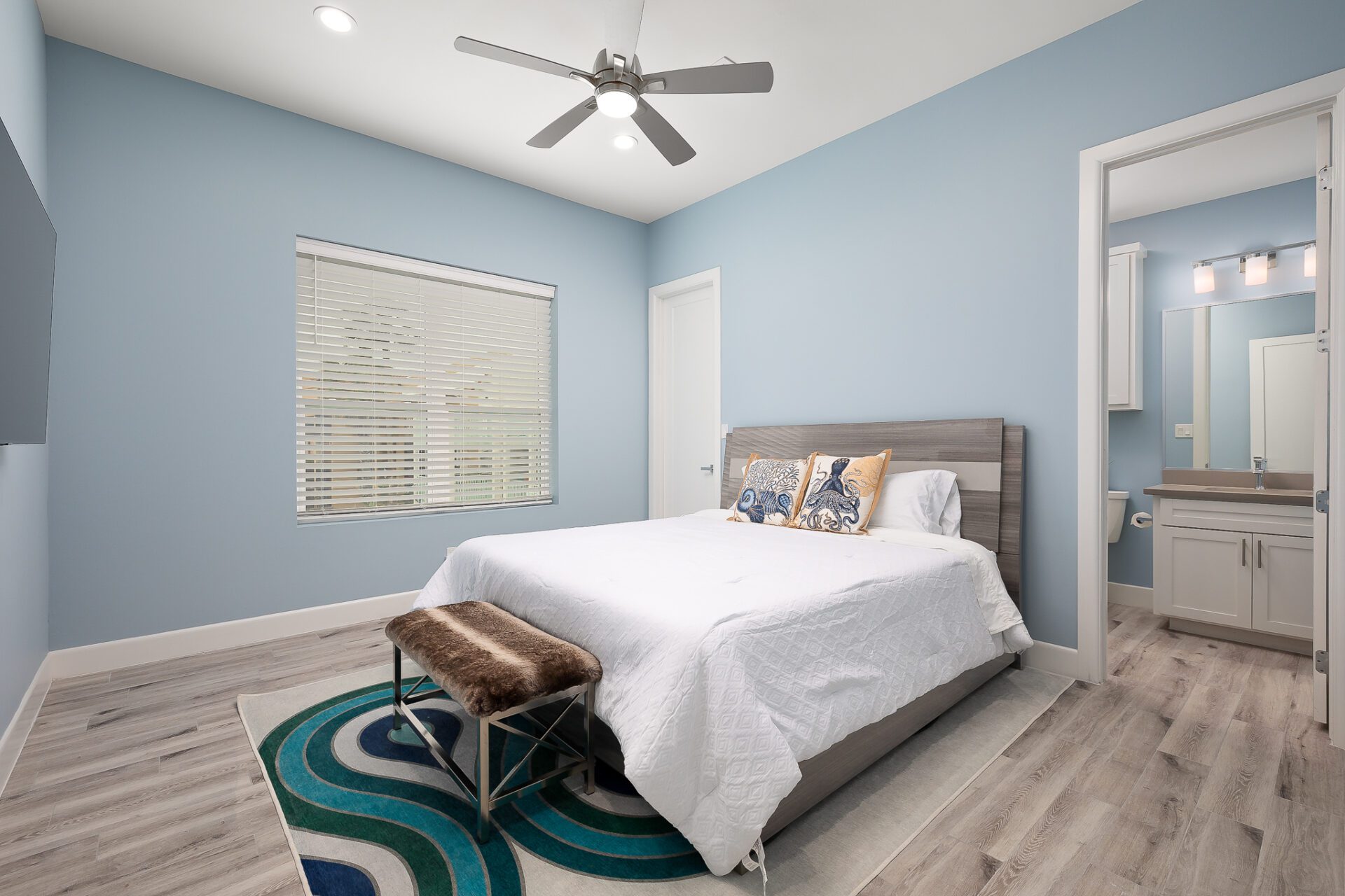 A bedroom with blue walls