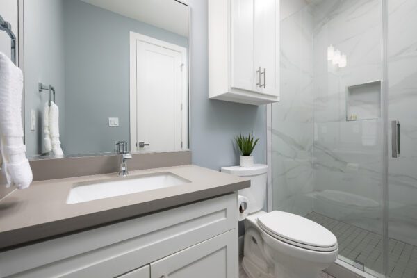 A clean bathroom with a toilet and sink